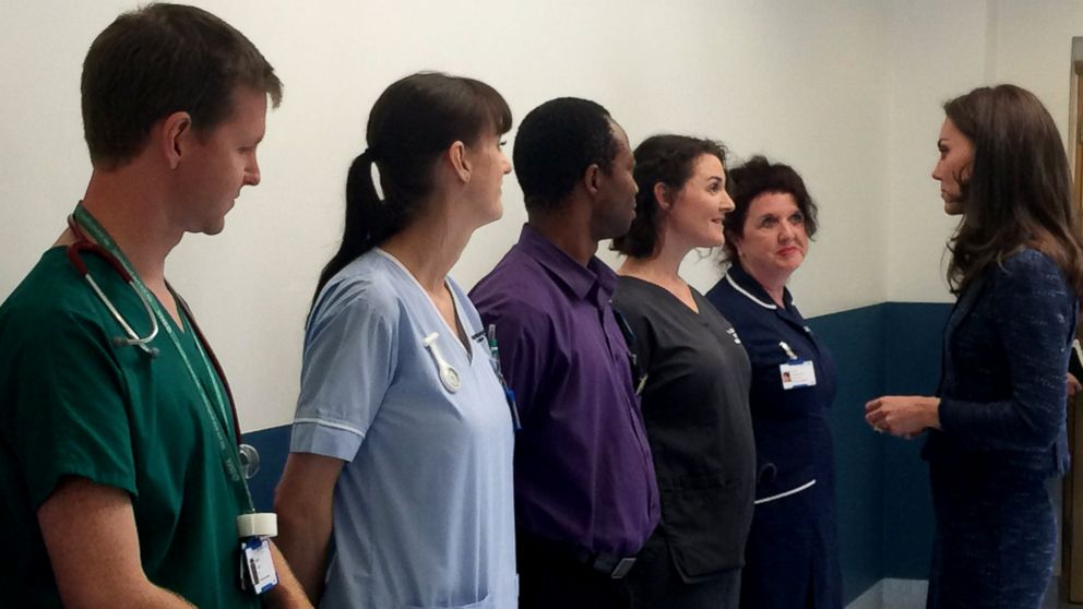 Kensington Palace posted this photo with this caption: "HRH meets some of the incredible doctors, nurses and support staff who describe their experiences to The Duchess," June 12, 2017.