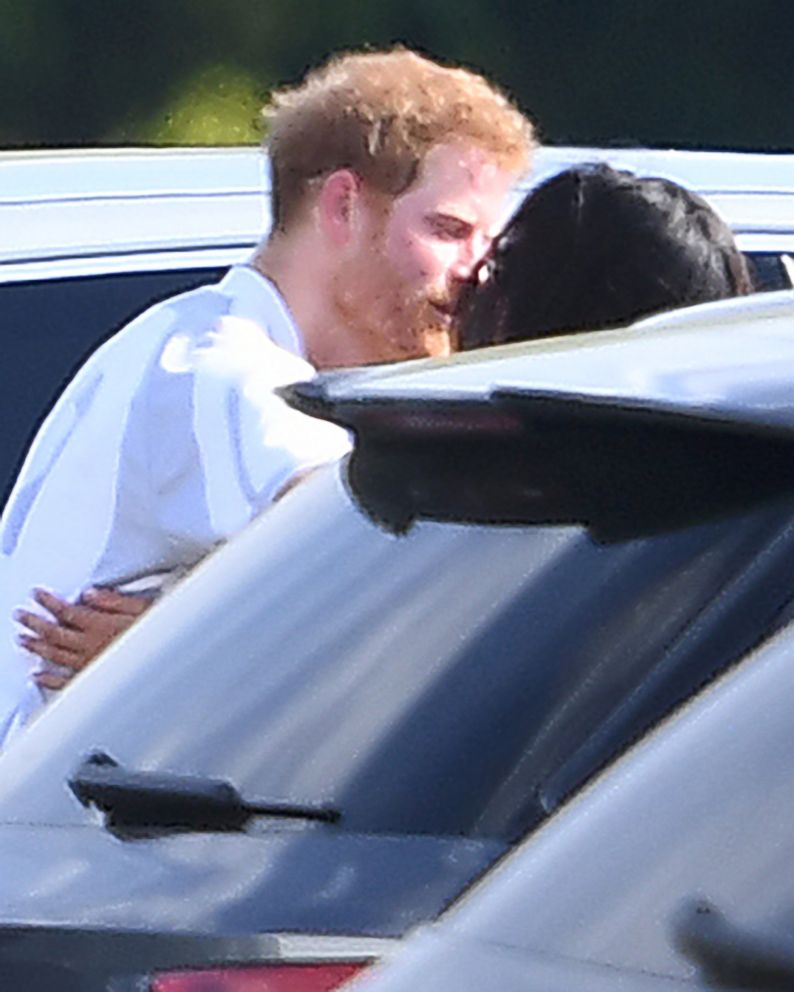 PHOTO: Prince Harry and Meghan Markle embrace at Coworth Park Polo Match in Ascot, Berkshire, U.K, May 7, 2017.