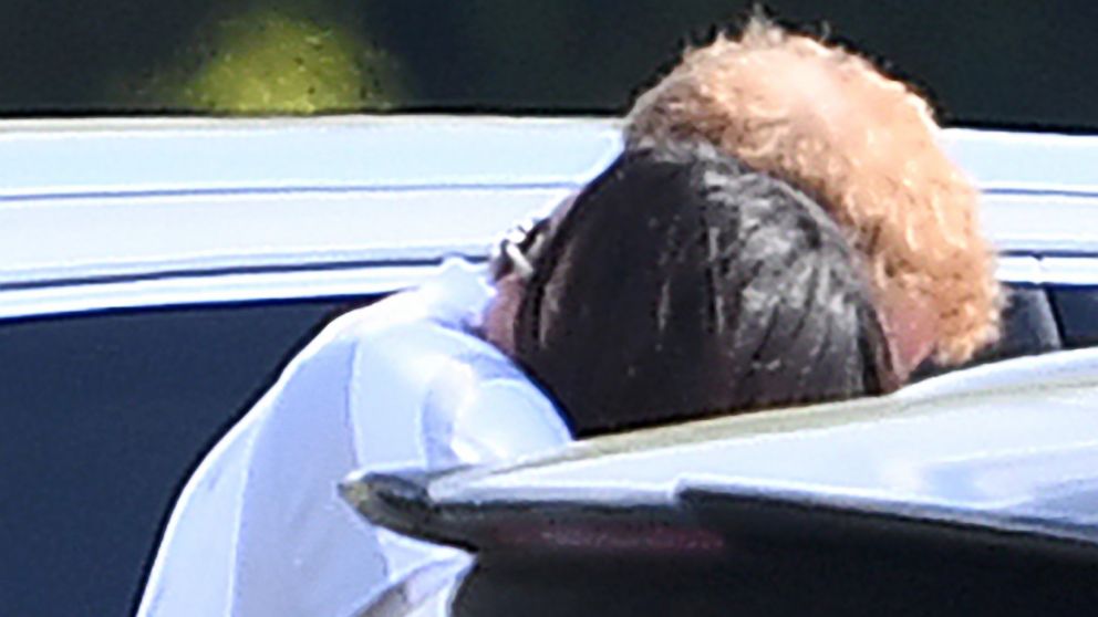 PHOTO: Prince Harry and Meghan Markle embrace at Coworth Park Polo Match in Ascot, Berkshire, U.K, May 7, 2017.
