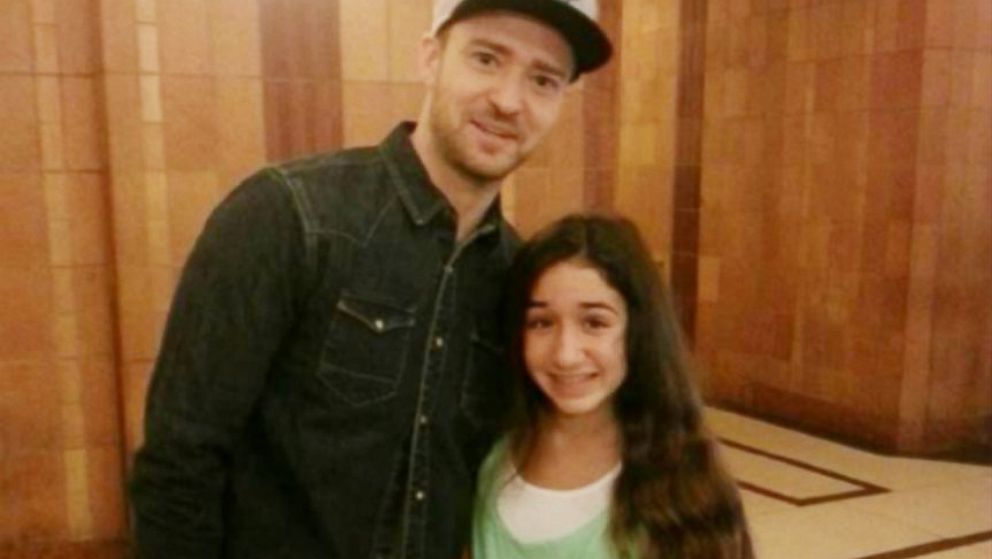 Justin Timberlake stops to take a photo with 13-year-old Giana DiLascio, who had life-saving brain surgery in 2012.