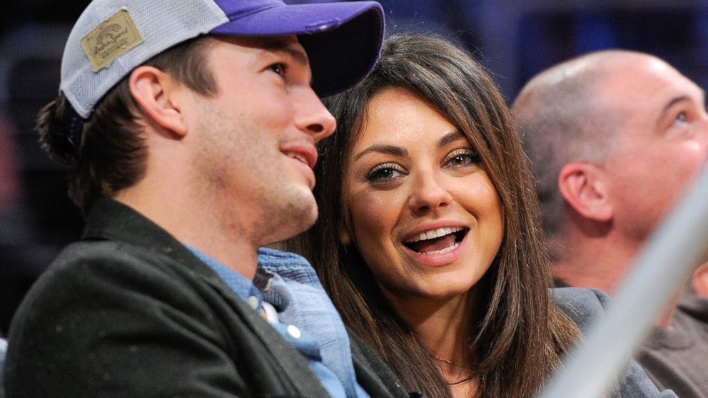 Ashton Kutcher and Mila Kunis attend a basketball game between the Utah Jazz and the Los Angeles Lakers at Staples Center,  Jan. 3, 2014, in Los Angeles.