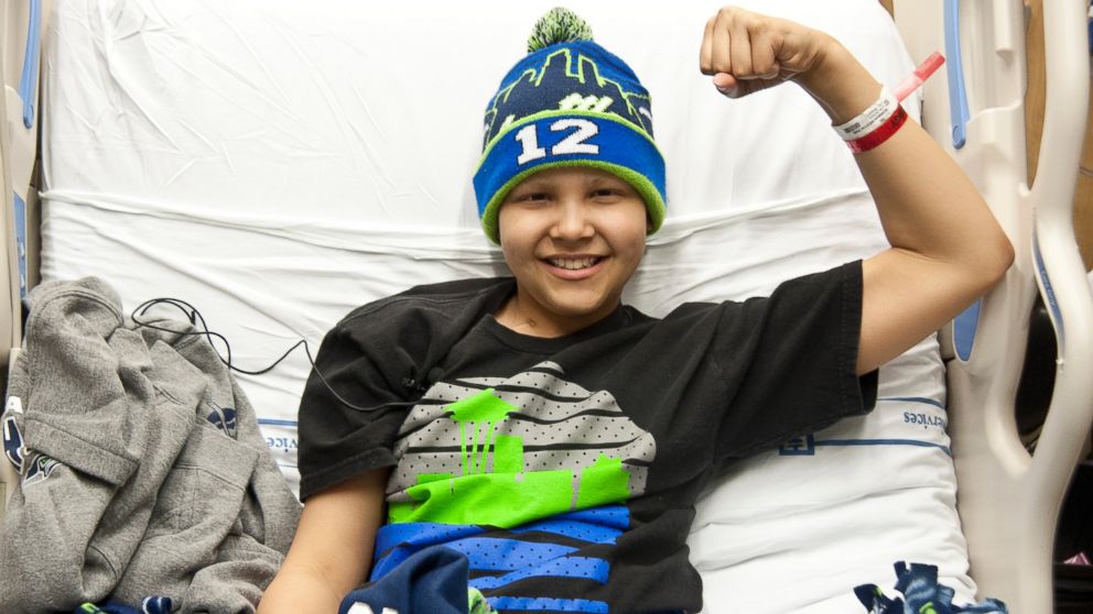 PHOTO: Seattle Children's Hospital patient, Dane Bowman-Weston flexes for Strong Against Cancer, Jan. 27, 2015.