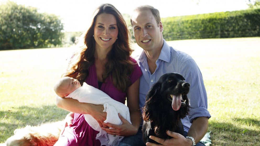The Duke and Duchess of Cambridge and Prince George are pictured with Lupo, the couple's cocker spaniel, in the garden of the Middleton family home in Bucklebury, Berkshire.