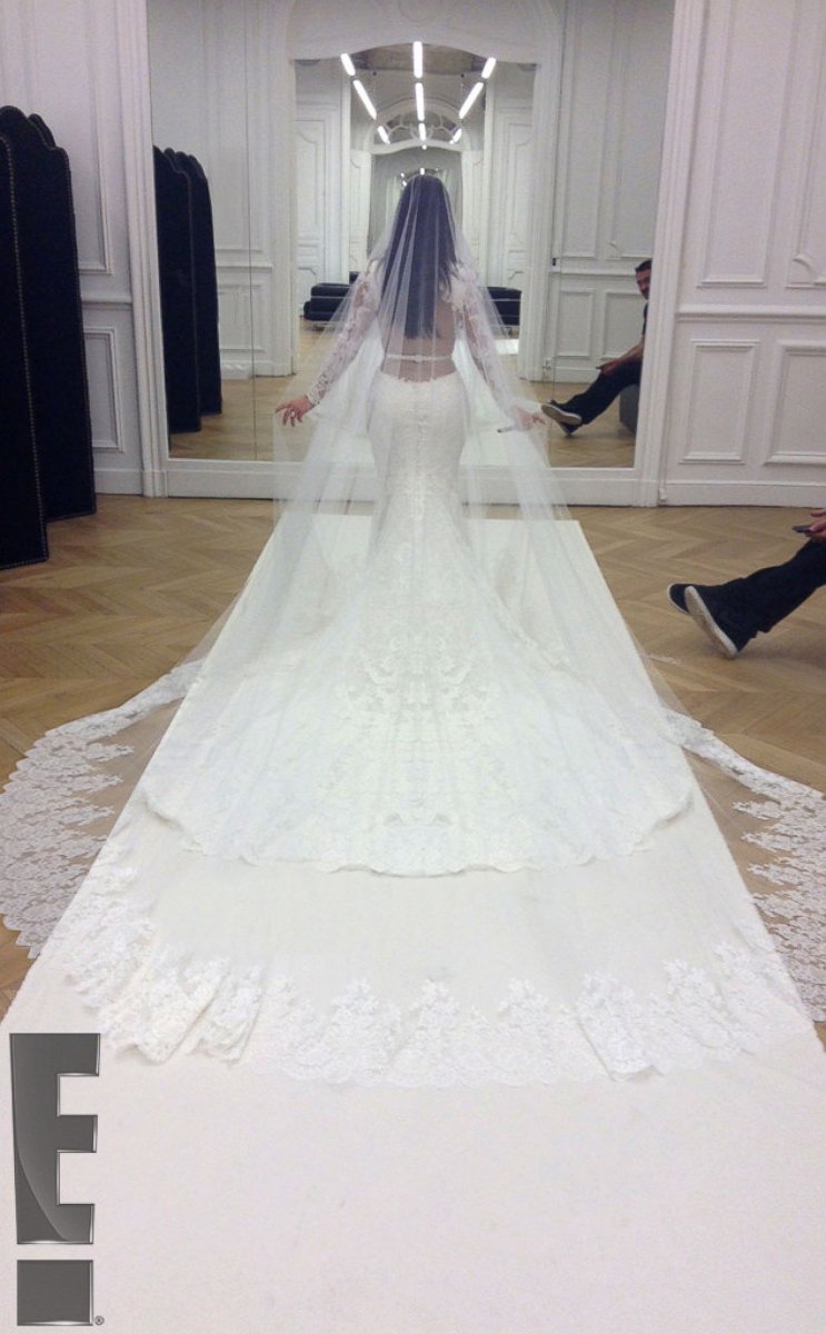 PHOTO: Kim Kardashian had one last fitting of her Givenchy Haute Couture lace gown at the Givenchy atelier in Paris before the wedding ceremony. <a href="http://www.eonline.com/news/545405/kim-kardashian-and-kanye-west-s-first-photos-as-a-married-couple-s