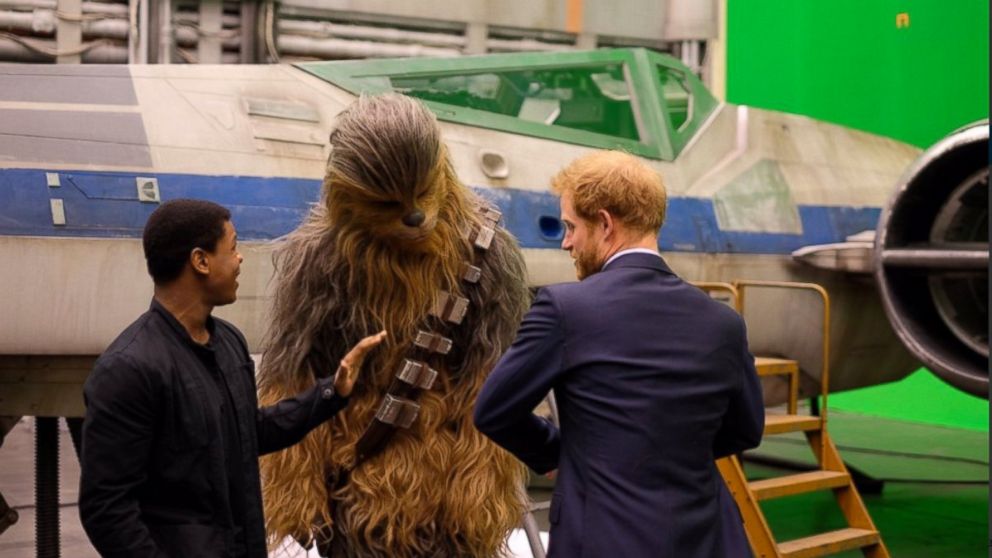 PHOTO:Prince Harry compares outfits with Chewbacca and John Boyega on his visit to the "Star Wars" set at Pinewood Studios in Iver, Buckinghamshire, April 19, 2016.  