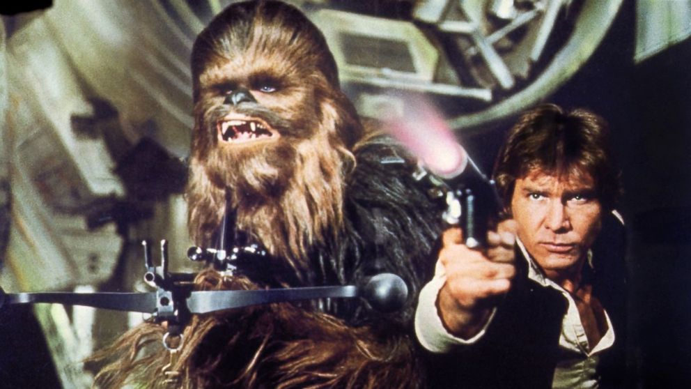 Peter Mayhew, left, as Chewbacca and Harrison Ford as Han Solo in a scene from "Star Wars: Episode IV - A New Hope."