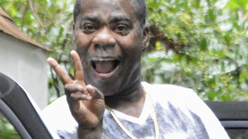 Tracy Morgan points his finger and smiles as he leaves his home in Cresskill, N.J., July 14, 2014. Morgan said he was ok and felt strong after the horrific car accident he was in.