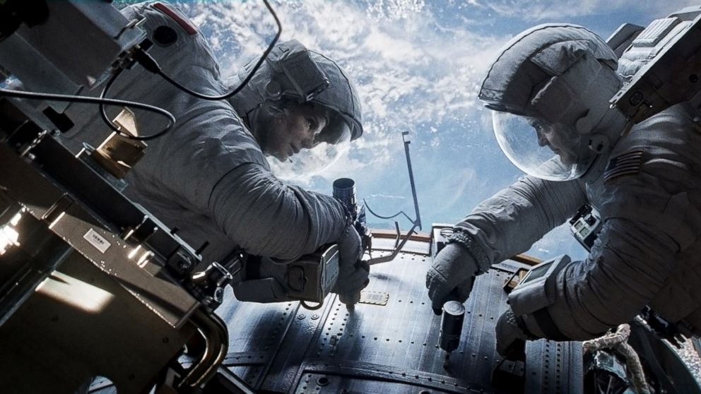 Sandra Bullock, left, as Dr. Ryan Stone and George Clooney as Matt Kowalsky in "Gravity."