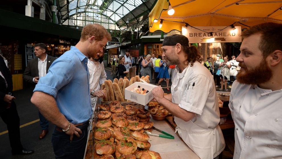 PHOTO: Prince Harry buys doughnuts from "Bread Ahead" stall during a visit to Borough Market in London, which has opened yesterday for the first time since the London Bridge terrorist attack, June 15, 2017. 
