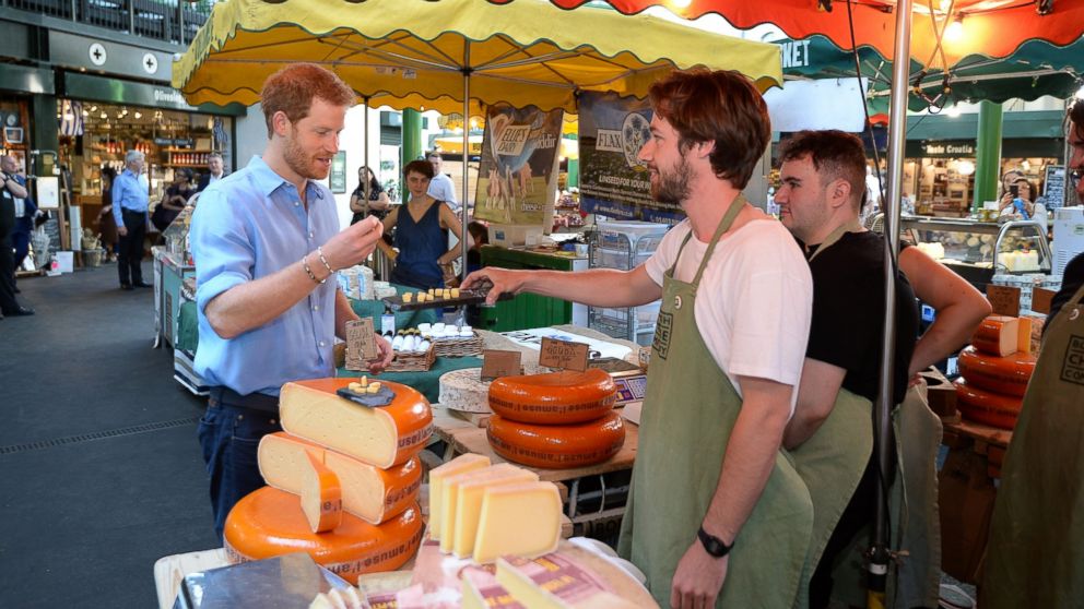 Prince Harry trying some cheese during a visit to Borough Market in London, which has opened yesterday for the first time since the London Bridge terrorist attack, June 15, 2017.