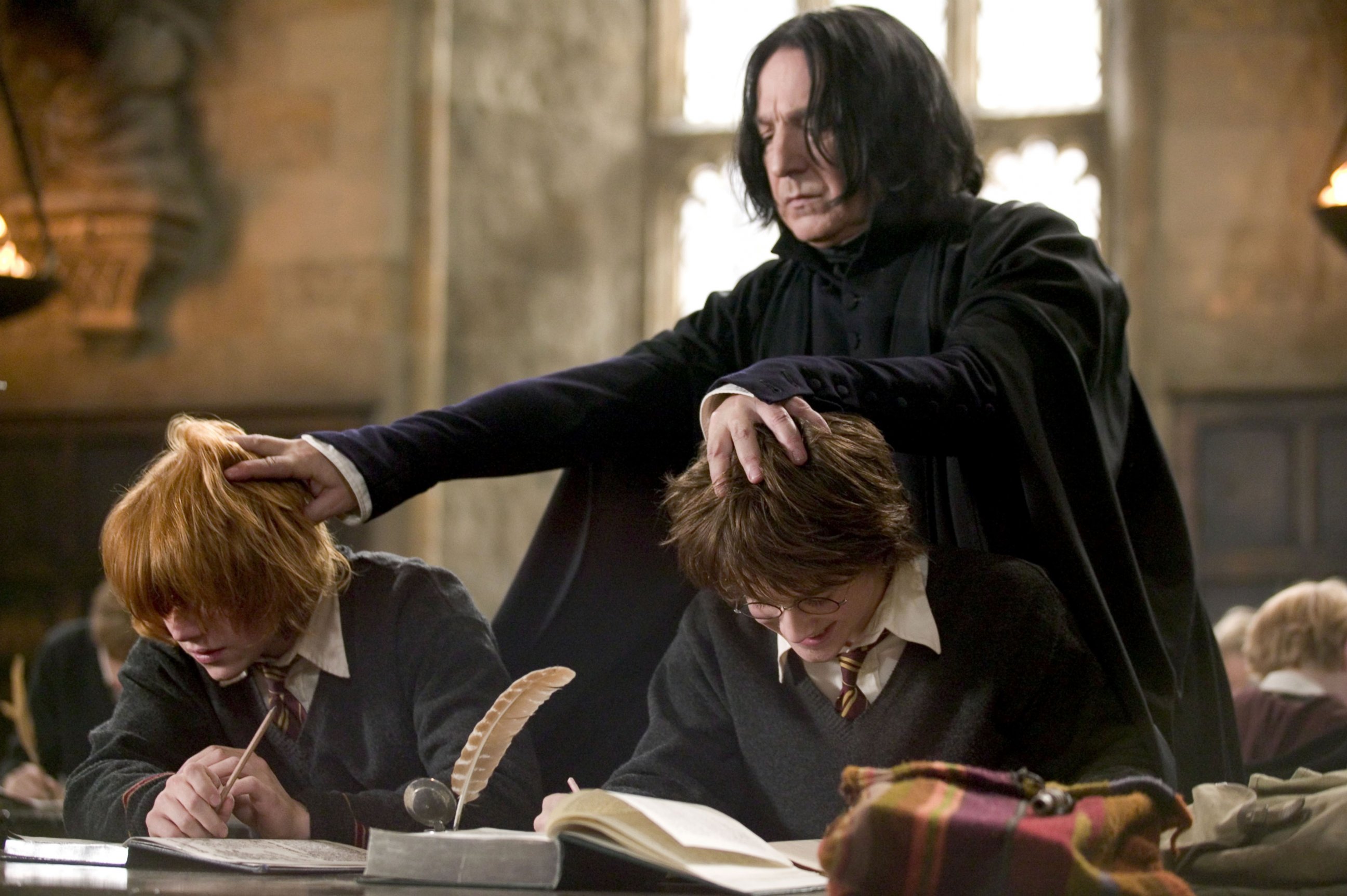 PHOTO: Alan Rickman (standing), Rupert Grint and Daniel Radcliffe (right), and are seen in a still from 'Harry Potter and the Goblet of Fire.'