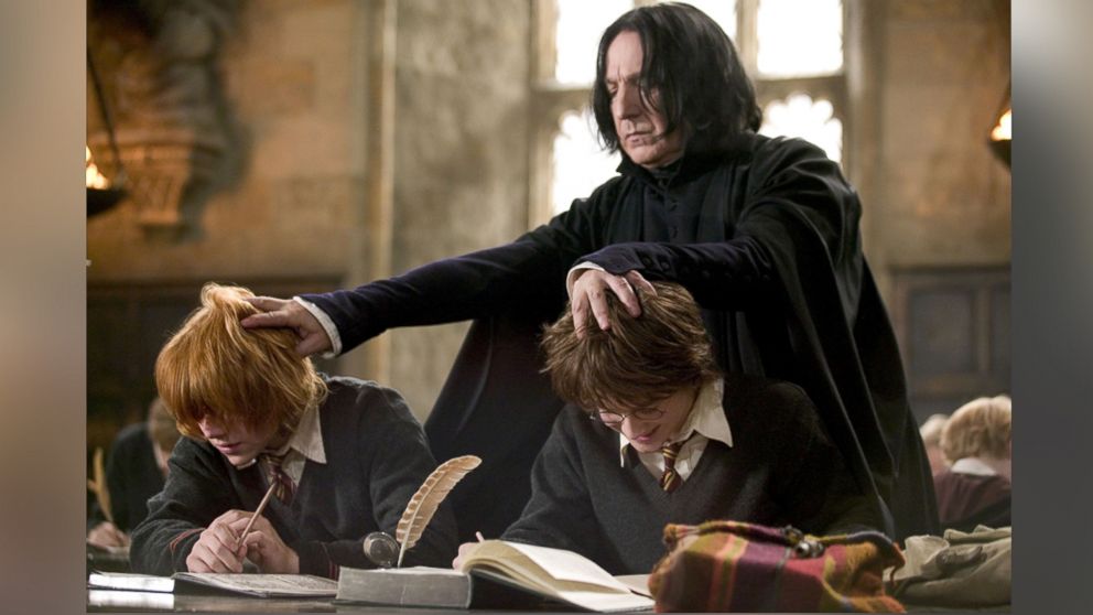 PHOTO: Alan Rickman (standing), Rupert Grint and Daniel Radcliffe (right), and are seen in a still from 'Harry Potter and the Goblet of Fire.'