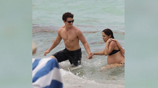 PHOTO: Miles Teller rescues a heavily pregnant woman and her child from a rip tide during a romantic afternoon on the beach with his girlfriend Keleigh Sperry, in Miami, on May 10, 2015. 