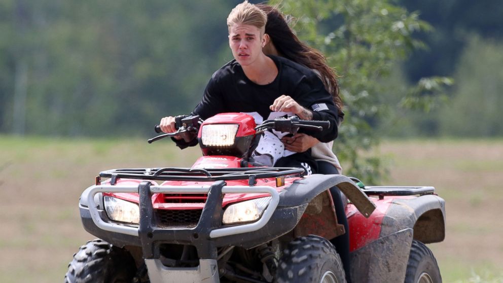 PHOTO: Justin Bieber and Selena Gomez are seen riding on an ATV in  Stratford, Canada, Aug. 29, 2014.