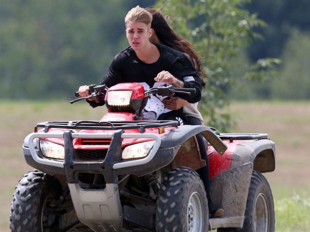 PHOTO: Justin Bieber and Selena Gomez are seen riding on an ATV in  Stratford, Canada, Aug. 29, 2014.