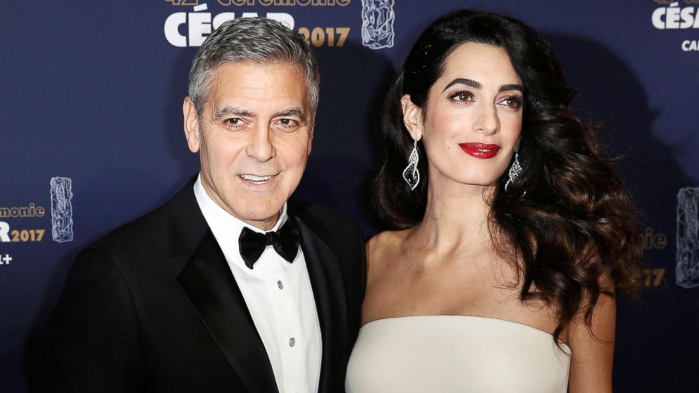 Actor George Clooney and his wife Amal pose as they arrive at the 42nd Cesar Awards ceremony in Paris, Feb. 24, 2017.
