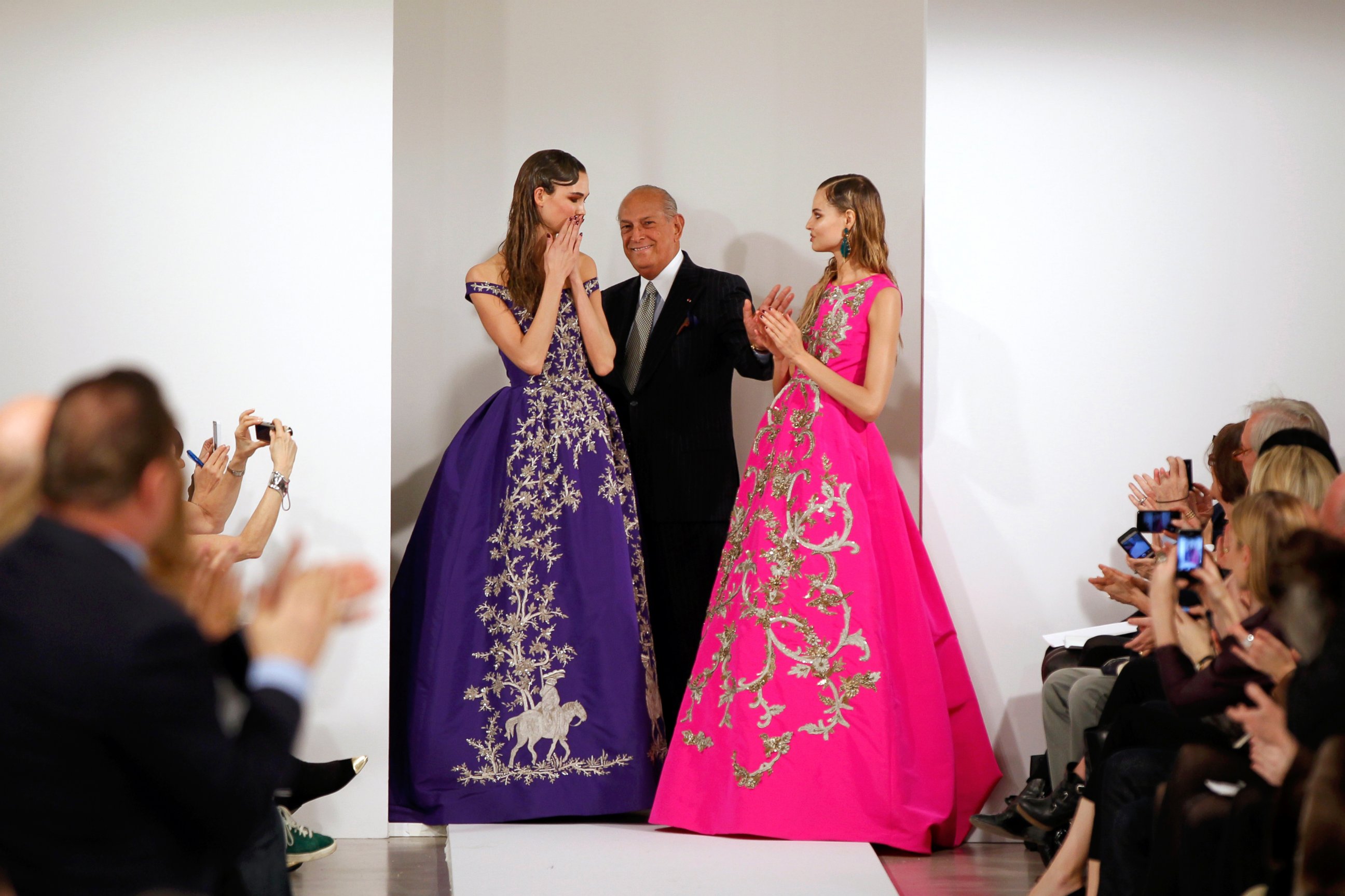 PHOTO: Designer Oscar De La Renta smiles with model Karlie Kloss and another model after presenting his Autumn/Winter 2013 collection during New York Fashion Week, Feb. 12, 2013.