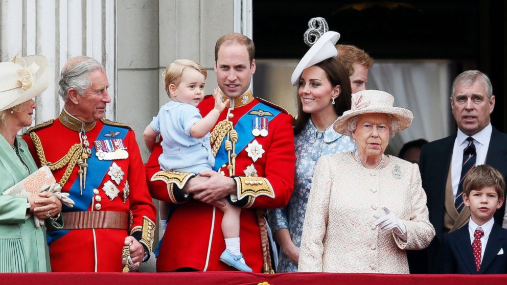 (L-R) Britain's Camilla The Duchess of Cornwall, Prince Charles, Prince William holding Prince George, Catherine, the Duchess of Cambridge, Queen Elizabeth, and Prince Andrew stand on the balcony at Buckingham Palace after attending the Trooping the Color ceremony at Horse Guards Parade in central London, June 13, 2015.