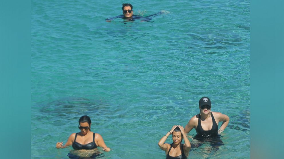 PHOTO: Pregnant Kim Kardashian, with sisters Kourtney and Khloe and her mother Kris Jenner, swim in a natural bathing pool after a 20 minute hike on Aug. 18, 2015 in St. Barths. 