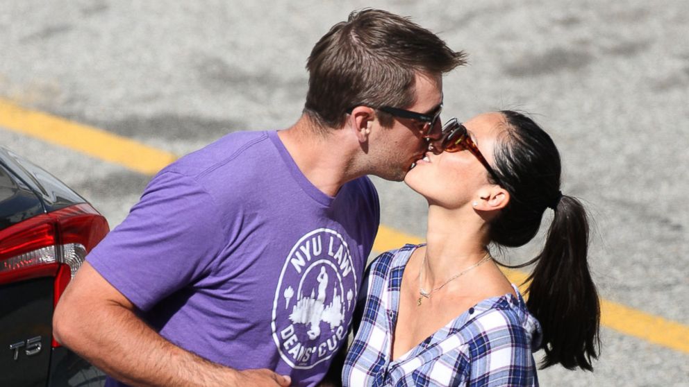 PHOTO: New hot Hollywood couple Olivia Munn and football star Aaron Rodgers kiss as he visits her on the set of her hit HBO show the Newsroom shooting on location in Los Angeles,Ca.