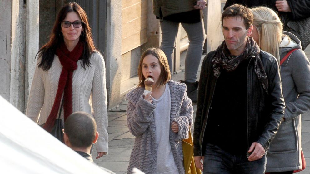Courteney Cox, left, is pictured with her daughter Coco Arquette, center, and boyfriend Johnny McDaid, right, in Venice, Italy on Feb. 17, 2014. 