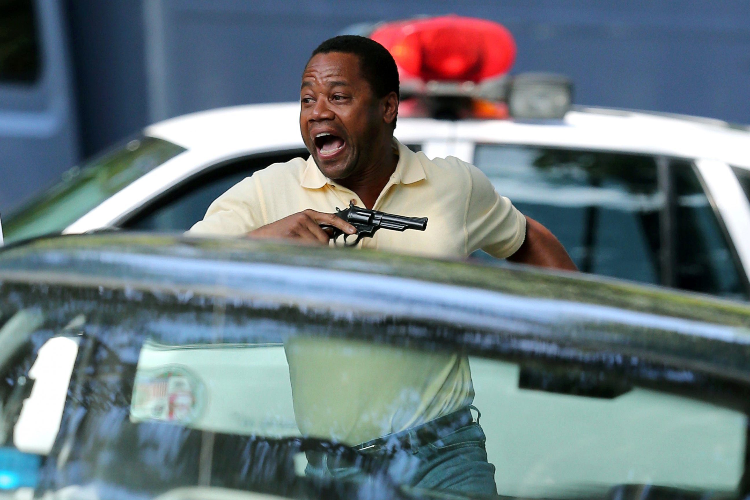 PHOTO: Cuba Gooding jr. brandishes a pistol in his underpants on the set of the upcoming drama 'American Crime Story: The People Vs OJ Simpson.