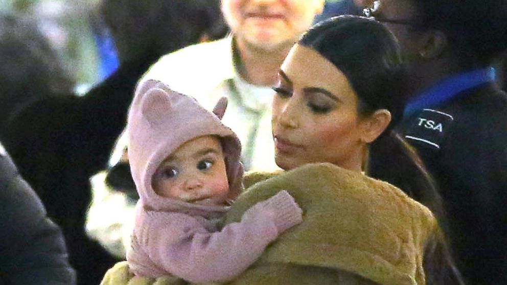 Kim Kardashian carries her baby North through John F. Kennedy International Airport on Feb. 25, 2014 in New York City.
