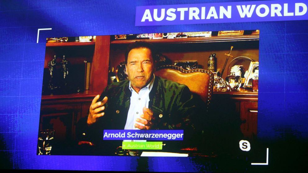 Former California Gov. Arnold Schwarzenegger is seen on a giant video screen during his online broadcasted speech as part of the 'Austrian World Summit' at the Spanish Riding School in Vienna, Austria, Thursday, Sept. 17, 2020. (AP Photo/Ronald Zak)