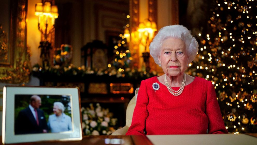 In this undated photo issued on Thursday Dec. 23, 2021, Britain's Queen Elizabeth II records her annual Christmas broadcast in Windsor Castle, Windsor, England. The photograph at left shows The Queen and Prince Philip taken in 2007 at Broadlands to m