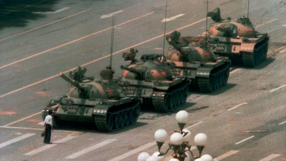 FILE - In this June 5, 1989, file photo, a Chinese man stands alone to block a line of tanks heading east on Beijing's Changan Blvd. in Tiananmen Square. An online snafu involving China’s most popular e-commerce livestreamer and a cake decorated to l