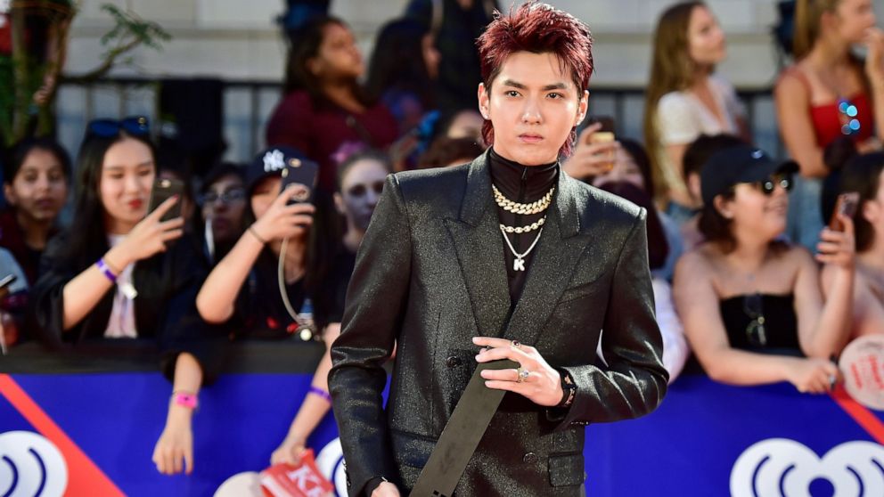 FILE - Singer Kris Wu celebrates his award for Fan Fave New Artist on the red carpet at the iHeartRadio MMVAs in Toronto on Aug. 26, 2018. A Beijing court on Friday, Nov. 25, 2022 sentenced Chinese-Canadian pop star Kris Wu to 13 years in prison on c