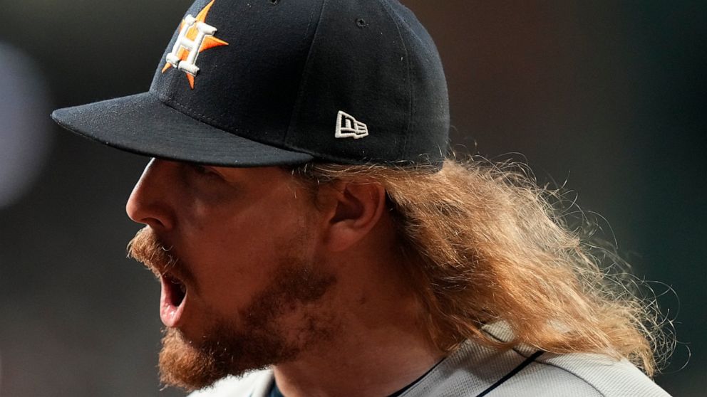 Houston Astros relief pitcher Ryne Stanek celebrates the last out in the seventh inning of Game 5 of baseball's World Series between the Houston Astros and the Atlanta Braves Sunday, Oct. 31, 2021, in Atlanta. (AP Photo/David J. Phillip)