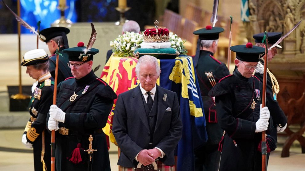 Britain's King Charles III, center, and other members of the royal family hold a vigil at the coffin of Queen Elizabeth II at St Giles' Cathedral, Edinburgh, Scotland, Monday Sept. 12, 2022. (Jane Barlow/Pool via AP)