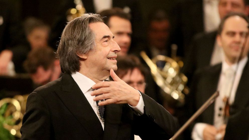 FILE - In this Jan. 1, 2018 file photo, Italian Maestro Riccardo Muti conducts the Vienna Philharmonic Orchestra during the traditional New Year's concert at the golden hall of Vienna's Musikverein, Austria. Muti has extended his contract as music di