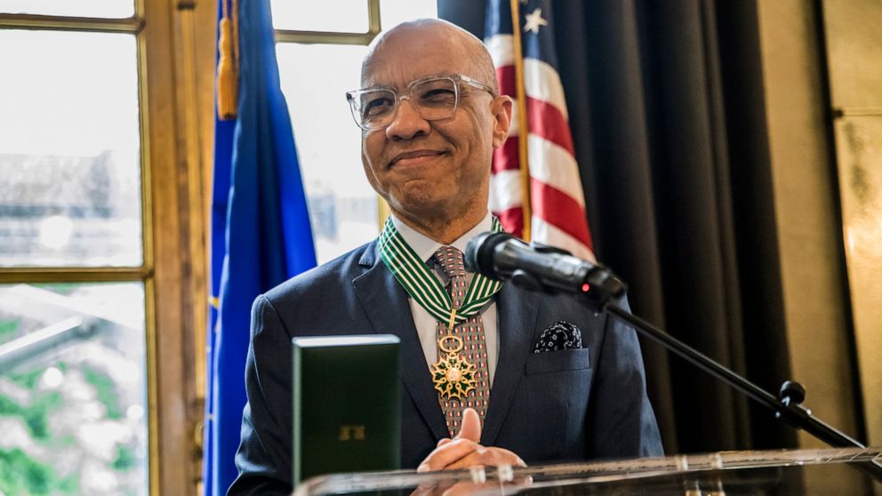 This photo provided by Ford Foundation shows Darren Walker, the president of the Ford Foundation receiving France’s highest cultural honor in recognition of his support of the arts and artists on Tuesday, May 24, 2022 at the French embassy in New Yor