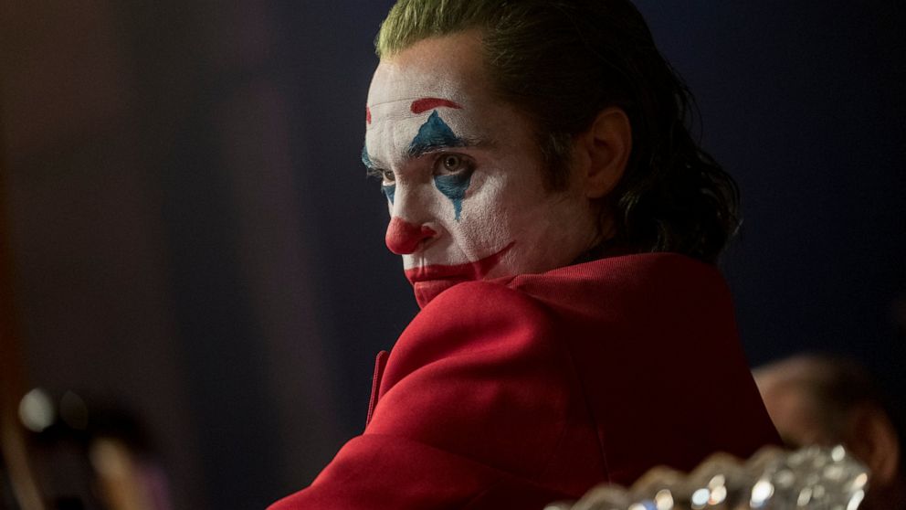 This image released by Warner Bros. Pictures shows Joaquin Phoenix in a scene from "Joker," in theaters on Oct. 4. Alarmed by violence depicted in a trailer for the upcoming movie “Joker,” some relatives of victims of the 2012 Aurora movie theater sh