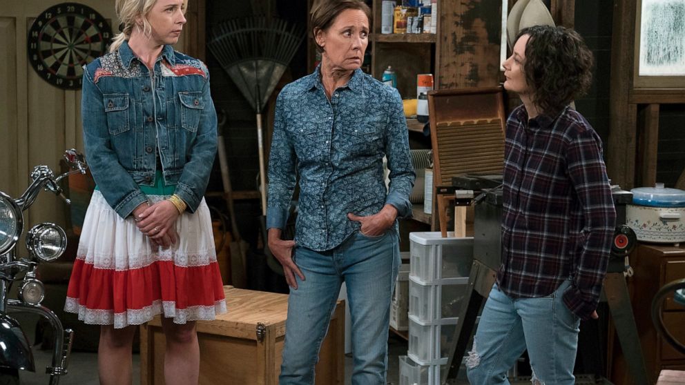 FILE - This image released by ABC shows Lecy Goranson, from left, Laurie Metcalf and Sara Gilbert in a scene from "The Connors." "The Conners" is airing a live episode Tuesday, Feb. 11, 2020, that will incorporate updates from the New Hampshire Democ