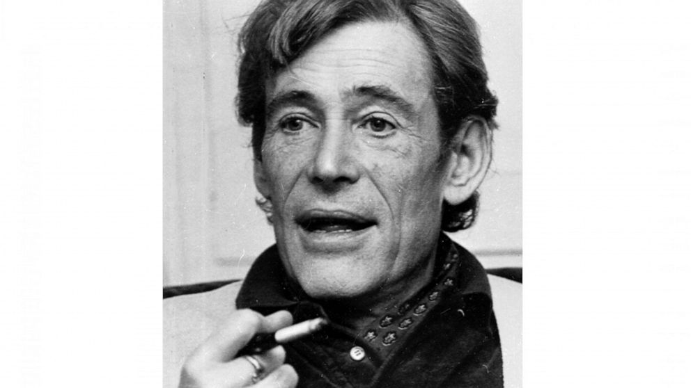 FILE - British actor Peter O'Toole smokes during an interview at his London home on Dec. 23, 1980. O'Toole appears in the 1982 film "My Favorite Year," which is celebrating its 40th anniversary. (AP Photo/Dave Caulkin, File)