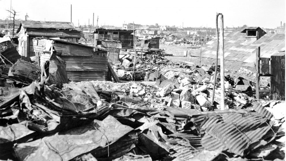 FILE - In this Sept. 7, 1945, file photo, makeshift housing built from galvanized iron roofing of burned buildings stand amid destruction and rubble in Tokyo. U.S. bombings of more than 60 Japanese cities from January 1944 to August 1945 killed an es