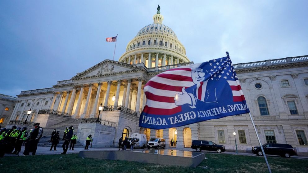 Trump supporters left a flag outside the Capitol, Wednesday evening, Jan. 6, 2021, in Washington. As Congress prepares to affirm President-elect Joe Biden's victory, thousands of people have gathered to show their support for President Donald Trump a