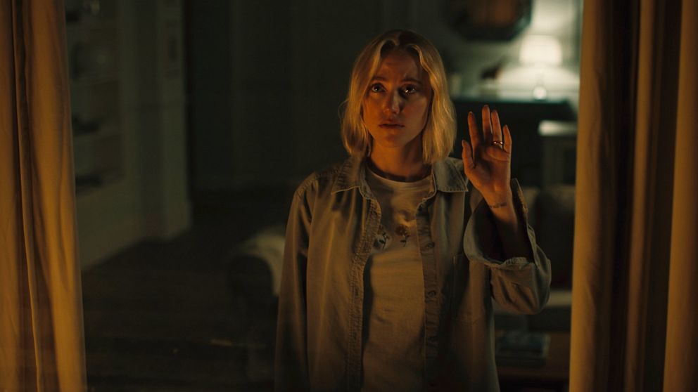 This image released by IFC Films shows Maika Monroe in a scene from "Watcher." (IFC Films via AP)
