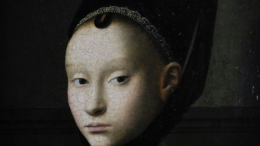 Detail of the painting by Petrus Christus titled Portrait of a Young Woman, around 1470, during a press preview of the Remember Me exhibit at the Rijksmuseum in Amsterdam, Netherlands, Tuesday, Sept. 28, 2021. As COVID-19 lockdowns ease and borders r