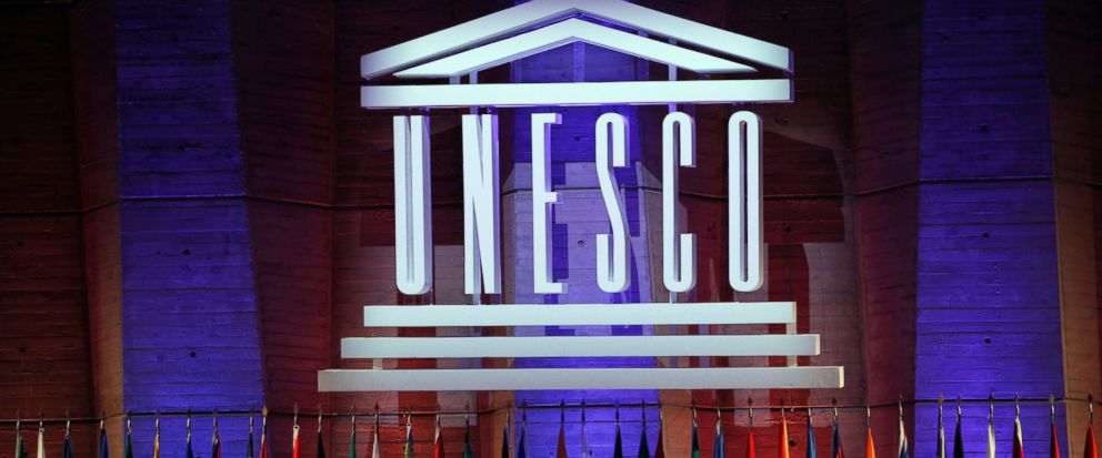 FILE - In this Saturday, Nov. 4, 2017 file photo, the logo of the United Nations Educational, Scientific and Cultural Organisation (UNESCO) is seen during the 39th session of the General Conference at the UNESCO headquarters in Paris, France. The Uni