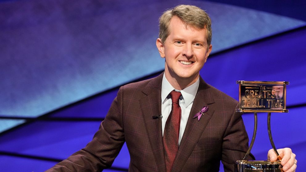 This image released by ABS shows contestant Ken Jennings with a trophy on "JEOPARDY! The Greatest of All Time." Jennings will be the first interim guest for the late Alex Trebek, and the show will try other guest hosts before naming a permanent repla