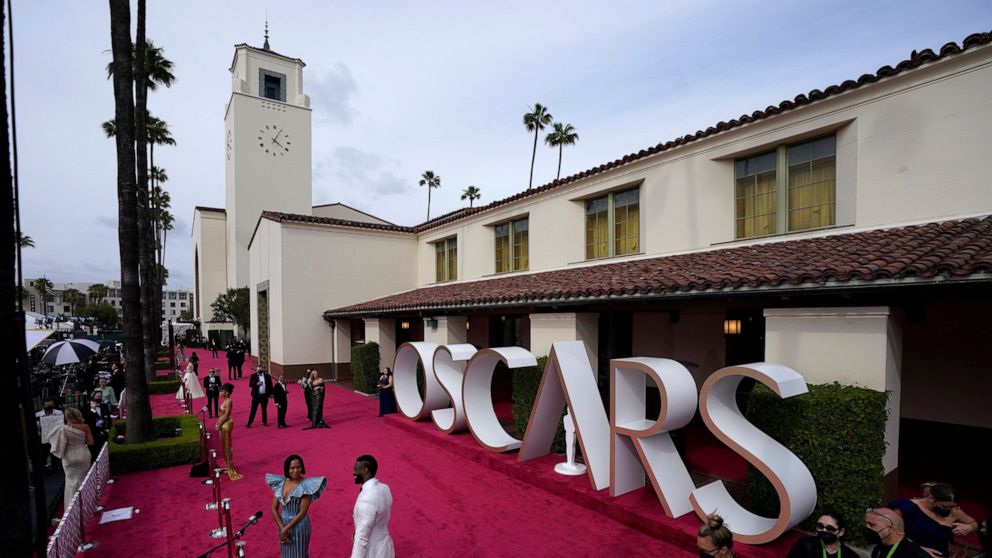 AP PHOTOS: Faces new and familiar at a most unusual Oscars