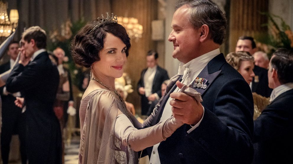This image released by Focus Features shows Elizabeth McGovern, left, as Lady Grantham and Hugh Bonneville, as Lord Grantham, in "Downton Abbey". The highly-anticipated film continuation of the “Masterpiece” series that wowed audiences for six season