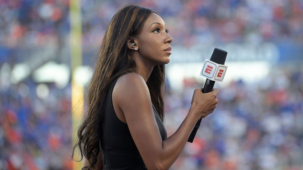 FILE - In this Aug. 24, 2019, file photo, ESPN's Maria Taylor works from the sideline during the first half of an NCAA college football game between Miami and Florida in Orlando, Fla. Taylor is leaving ESPN after the two sides were unable to reach an