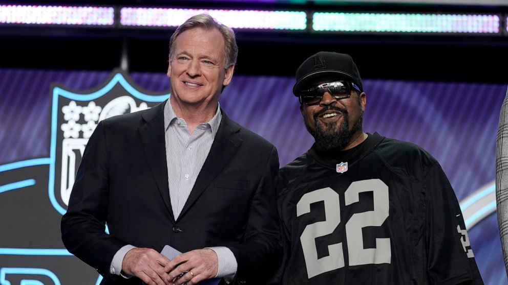 FILE - Rapper Ice Cube, right, poses with NFL Commissioner Roger Goodell during the first round of the NFL football draft Thursday, April 28, 2022, in Las Vegas. The NFL is teaming up with Ice Cube. The league announced Thursday, June 30, 2022, a par