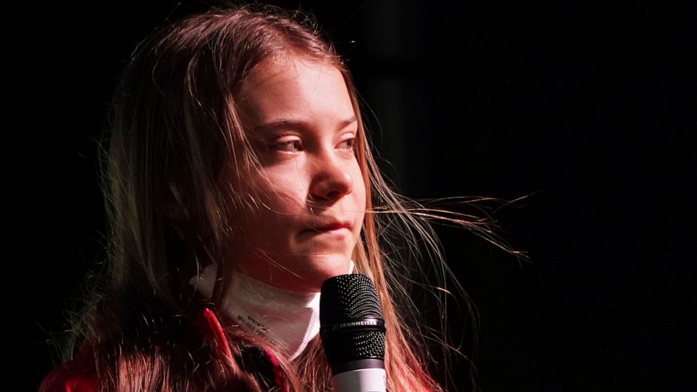 FILE - Swedish climate activist Greta Thunberg speaks on the stage of a demonstration in Glasgow, Scotland, Friday, Nov. 5, 2021 which is the host city of the COP26 U.N. Climate Summit. Thunberg has compiled a handbook for tackling the world’s interc