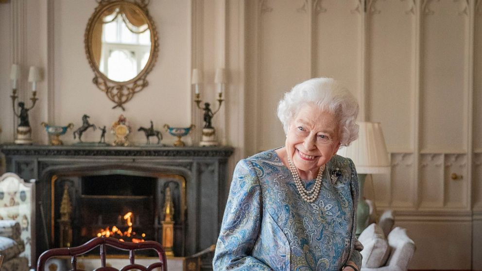 FILE - Britain's Queen Elizabeth II smiles while receiving the President of Switzerland Ignazio Cassis and his wife Paola Cassis during an audience at Windsor Castle in Windsor, England, Thursday, April 28, 2022. Queen Elizabeth II, Britain’s longest